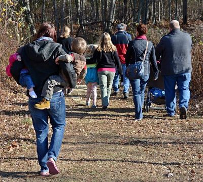 Photo of Families walking down a hiking trail